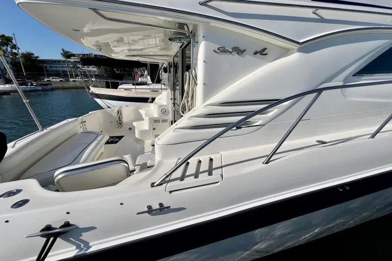 Get Nuts Yacht Photos Pics 2000 Sea Ray 400 Sedan Bridge yacht docked, showcasing sleek design and spacious deck.