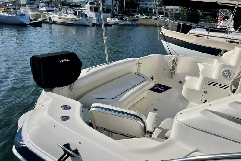 Get Nuts Yacht Photos Pics 2000 Sea Ray 400 Sedan Bridge yacht interior with seating, docked in marina.