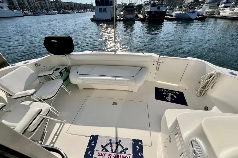 Get Nuts Yacht Photos Pics Spacious deck of 2000 Sea Ray 400 Sedan Bridge yacht in marina setting.