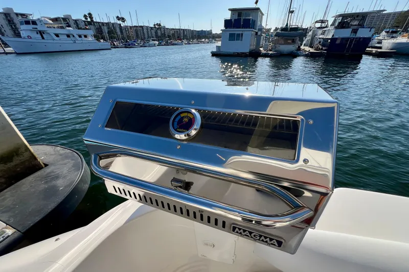 Get Nuts Yacht Photos Pics Stainless steel Magma grill on 2000 Sea Ray 400 Sedan Bridge, docked in marina.