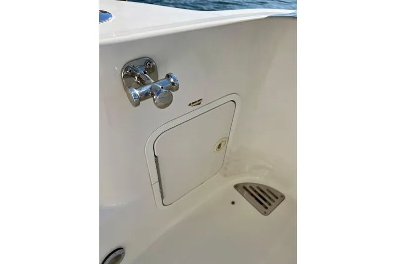 Get Nuts Yacht Photos Pics Sea Ray 400 Sedan Bridge 2000 boat detail with chrome fixture and storage compartment.