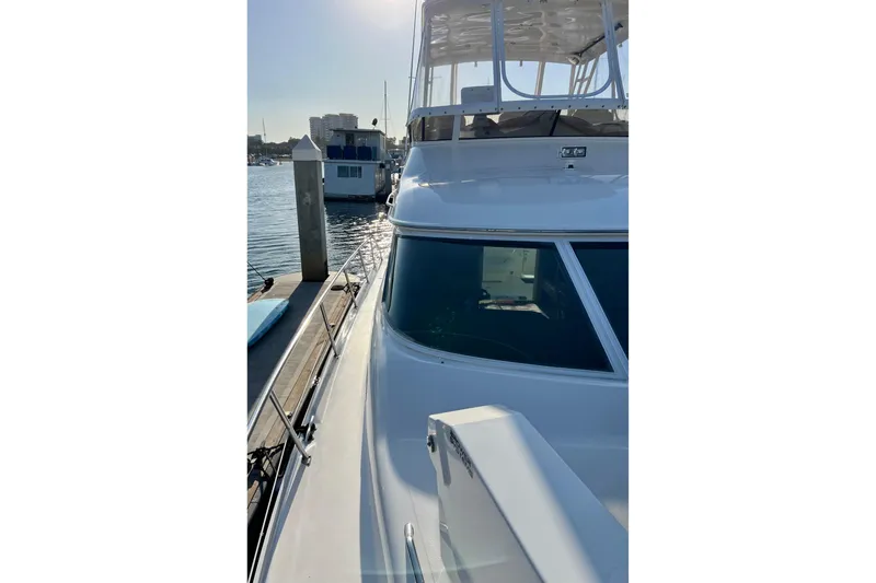 Get Nuts Yacht Photos Pics 2000 Sea Ray 400 Sedan Bridge yacht docked at marina, sunny day.