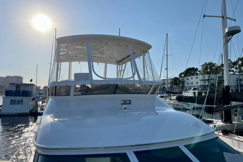 Get Nuts Yacht Photos Pics 2000 Sea Ray 400 Sedan Bridge yacht docked in sunny marina.