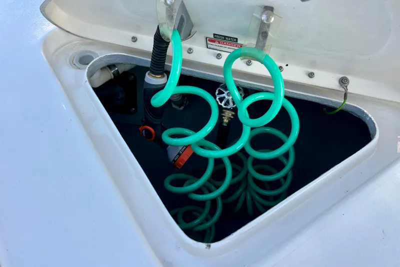 Get Nuts Yacht Photos Pics Open hatch with coiled hose on 2000 Sea Ray 400 Sedan Bridge.