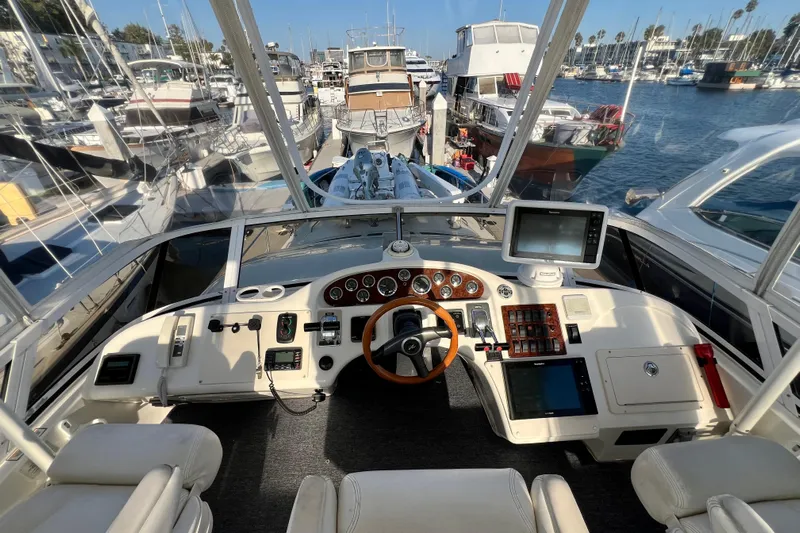 Get Nuts Yacht Photos Pics Cockpit view of 2000 Sea Ray 400 Sedan Bridge yacht in marina.