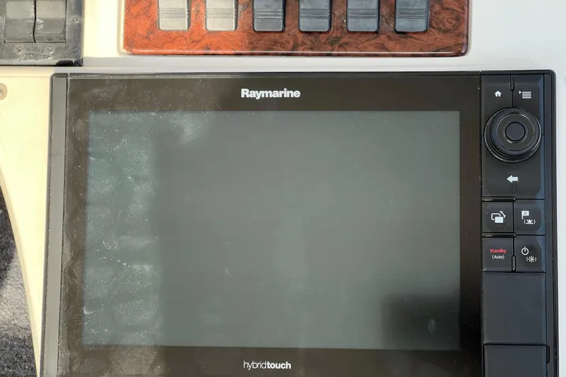 Get Nuts Yacht Photos Pics Raymarine hybridtouch display on 2000 Sea Ray 400 Sedan Bridge yacht dashboard.