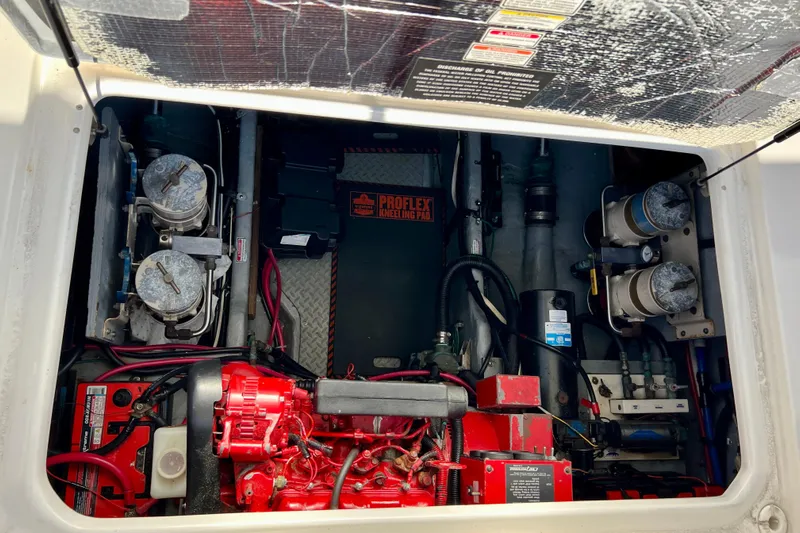 Get Nuts Yacht Photos Pics Engine compartment of a 2000 Sea Ray 400 Sedan Bridge with visible components and wiring.