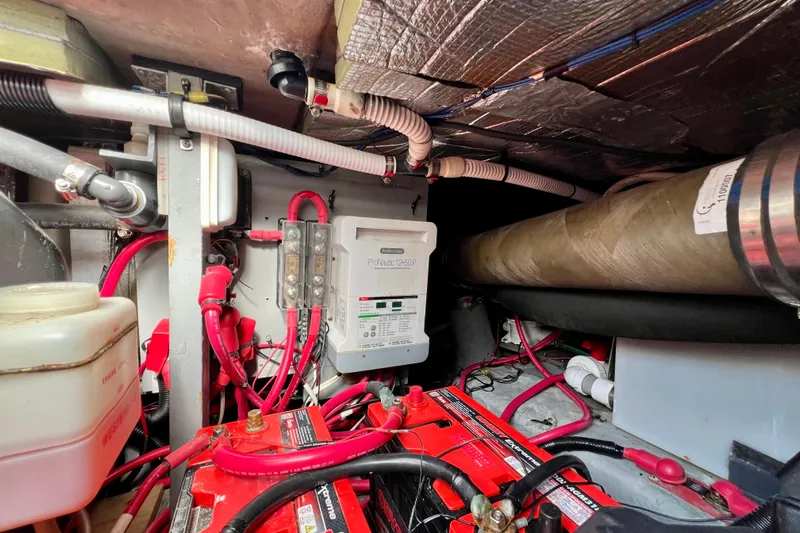 Get Nuts Yacht Photos Pics Engine room of 2000 Sea Ray 400 Sedan Bridge with batteries and wiring.