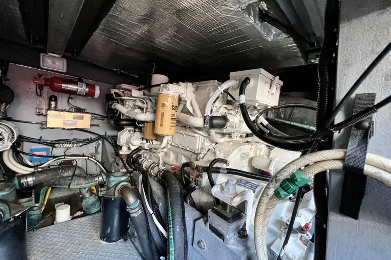 Get Nuts Yacht Photos Pics Engine room of a 2000 Sea Ray 400 Sedan Bridge with visible machinery and components.