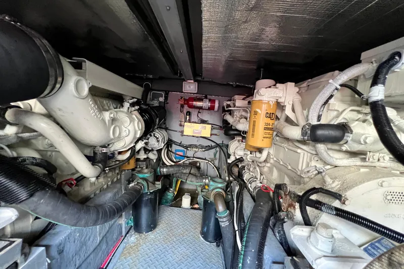 Get Nuts Yacht Photos Pics Engine room of 2000 Sea Ray 400 Sedan Bridge with visible components and wiring.