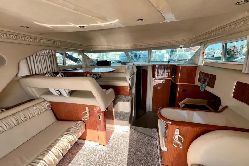 Get Nuts Yacht Photos Pics Interior of 2000 Sea Ray 400 Sedan Bridge yacht, featuring elegant seating and wood finishes.