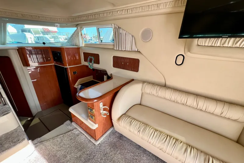 Get Nuts Yacht Photos Pics Interior of 2000 Sea Ray 400 Sedan Bridge yacht with beige seating and wood accents.