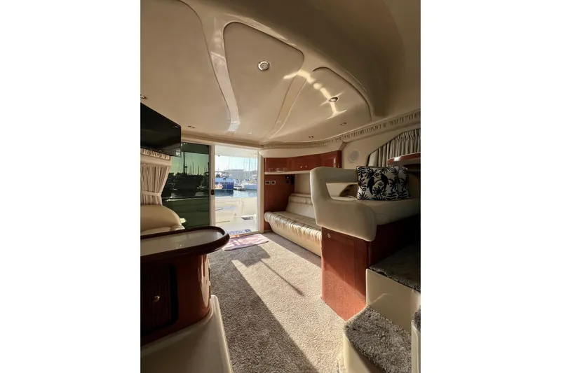 Get Nuts Yacht Photos Pics Luxurious interior of 2000 Sea Ray 400 Sedan Bridge yacht with elegant seating and decor.