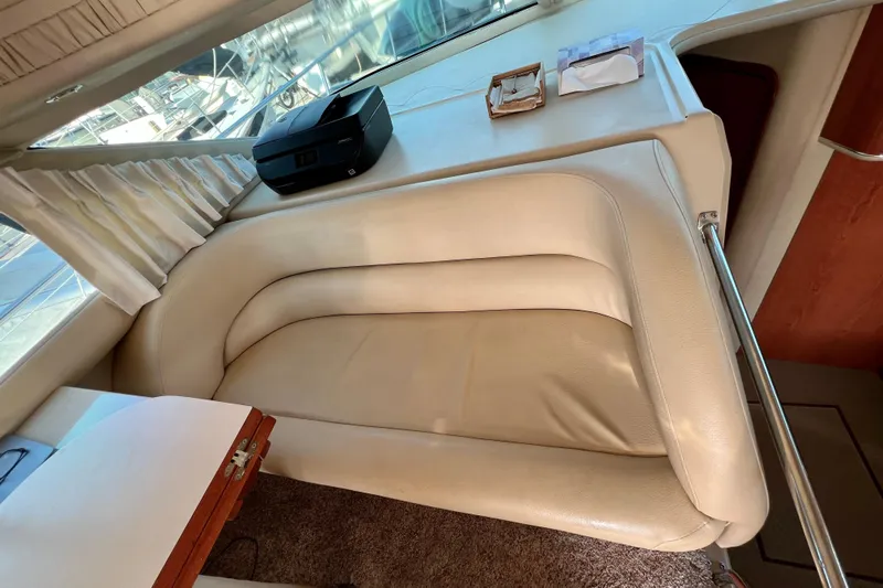 Get Nuts Yacht Photos Pics Luxurious interior of 2000 Sea Ray 400 Sedan Bridge with cream leather seating.