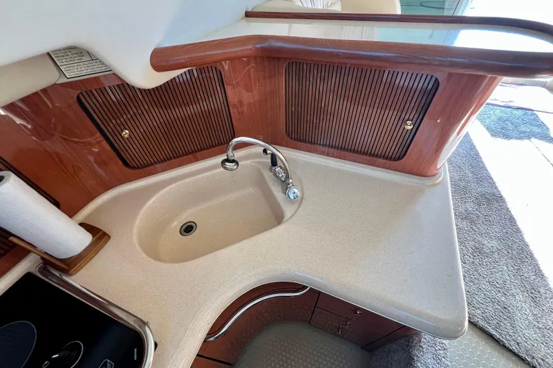 Get Nuts Yacht Photos Pics Luxurious kitchen sink area on a 2000 Sea Ray 400 Sedan Bridge yacht.