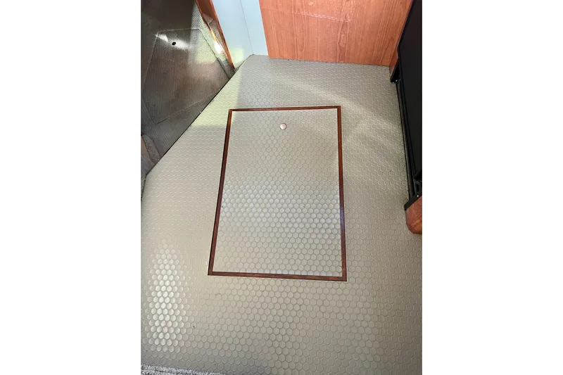 Get Nuts Yacht Photos Pics Floor hatch on 2000 Sea Ray 400 Sedan Bridge with hexagonal pattern.