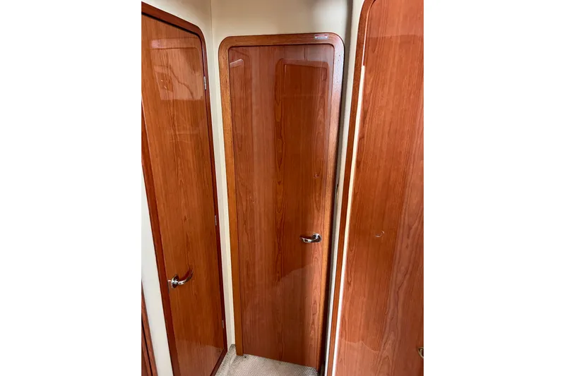 Get Nuts Yacht Photos Pics Interior view of 2000 Sea Ray 400 Sedan Bridge with wooden doors.