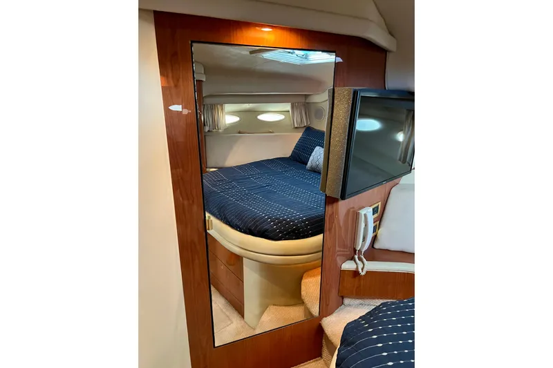 Get Nuts Yacht Photos Pics Interior of 2000 Sea Ray 400 Sedan Bridge with cozy bedroom and modern amenities.