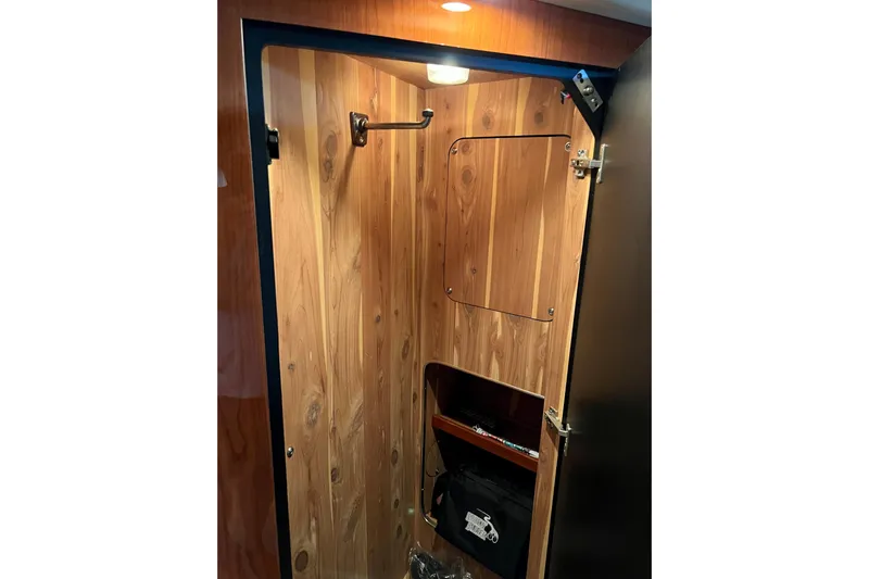 Get Nuts Yacht Photos Pics Wood-paneled closet interior on 2000 Sea Ray 400 Sedan Bridge yacht.