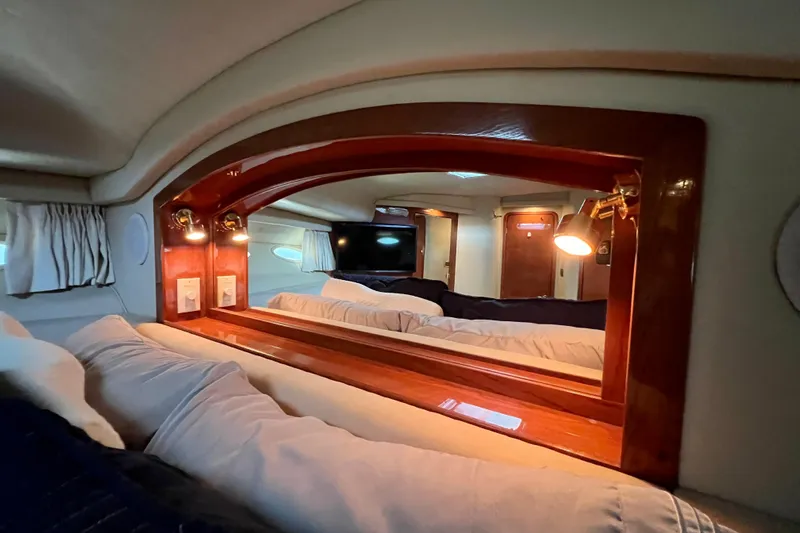 Get Nuts Yacht Photos Pics Luxurious cabin interior of 2000 Sea Ray 400 Sedan Bridge yacht with elegant wood finish.