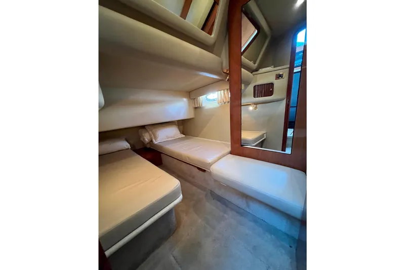 Get Nuts Yacht Photos Pics Interior cabin of 2000 Sea Ray 400 Sedan Bridge with twin beds and mirror.