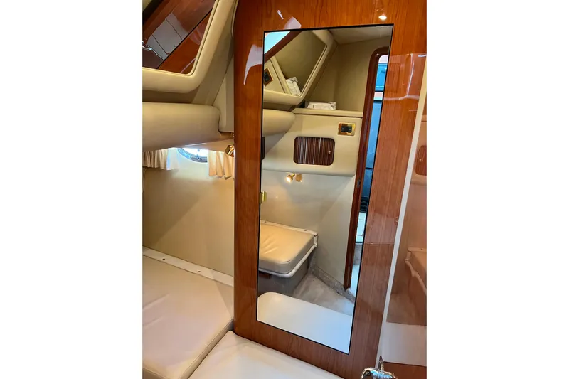 Get Nuts Yacht Photos Pics Interior of 2000 Sea Ray 400 Sedan Bridge yacht with mirror and seating area.