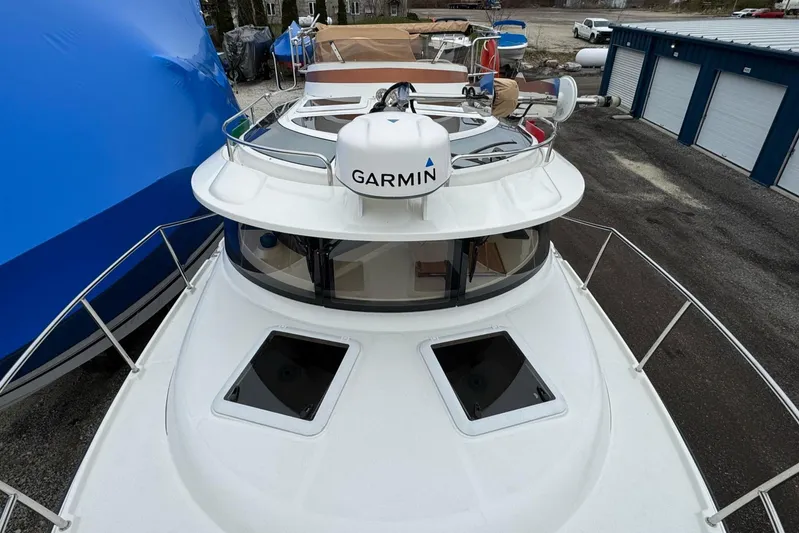 Tug Life Yacht Photos Pics 2017 Ranger Tugs R-29 CB boat with Garmin radar, docked in a marina.