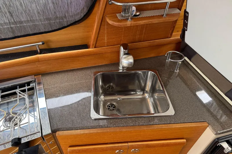 Tug Life Yacht Photos Pics Compact kitchen sink in 2017 Ranger Tugs R-29 CB boat interior.
