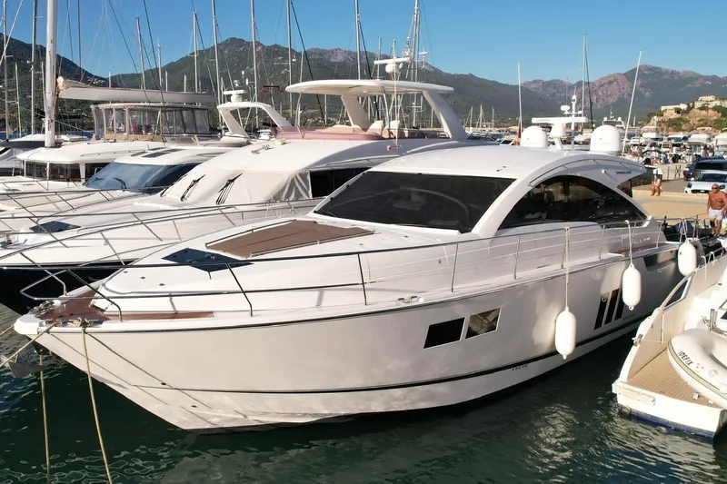  Yacht Photos Pics 2013 Fairline Targa 62 GT yacht docked in a marina with scenic mountain backdrop.