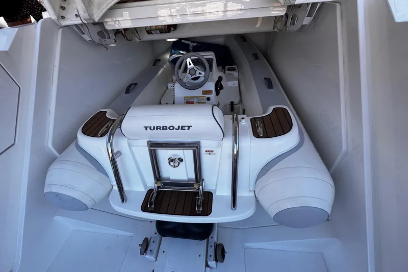  Yacht Photos Pics Fairline Targa 62 GT 2013 yacht with Turbojet tender in storage compartment.