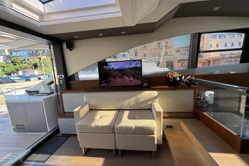  Yacht Photos Pics Interior of 2013 Fairline Targa 62 GT yacht with modern seating and TV.