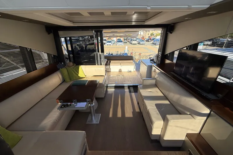  Yacht Photos Pics Luxurious interior of 2013 Fairline Targa 62 GT yacht with beige seating and modern decor.