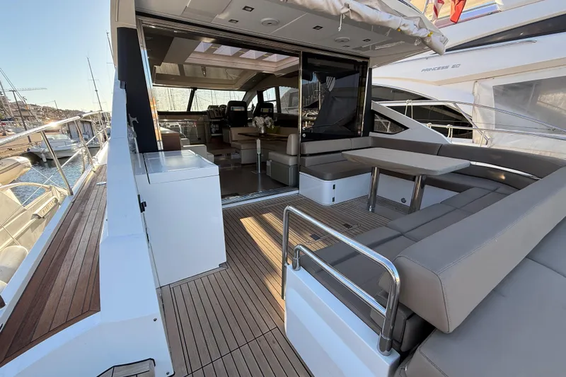  Yacht Photos Pics Luxurious 2013 Fairline Targa 62 GT yacht with spacious outdoor seating and elegant interior.