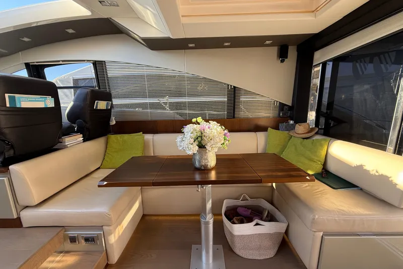  Yacht Photos Pics Luxurious interior of 2013 Fairline Targa 62 GT yacht with elegant seating and table.