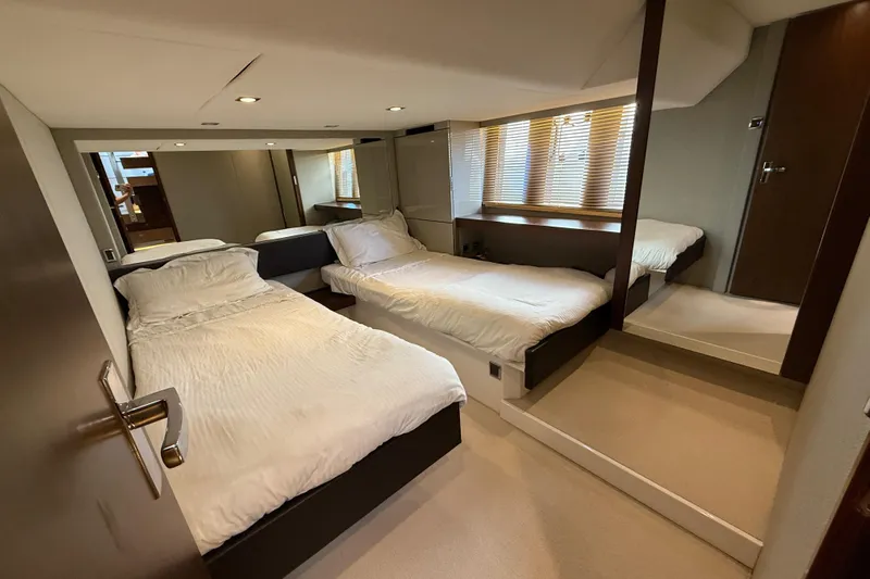  Yacht Photos Pics Luxurious twin bedroom in 2013 Fairline Targa 62 GT yacht with modern decor.