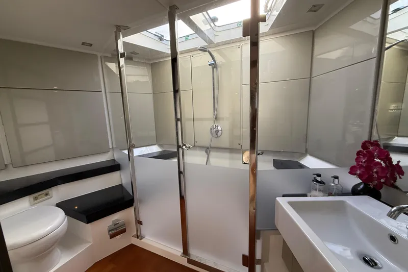  Yacht Photos Pics Luxurious bathroom in 2013 Fairline Targa 62 GT yacht with modern fixtures and elegant design.