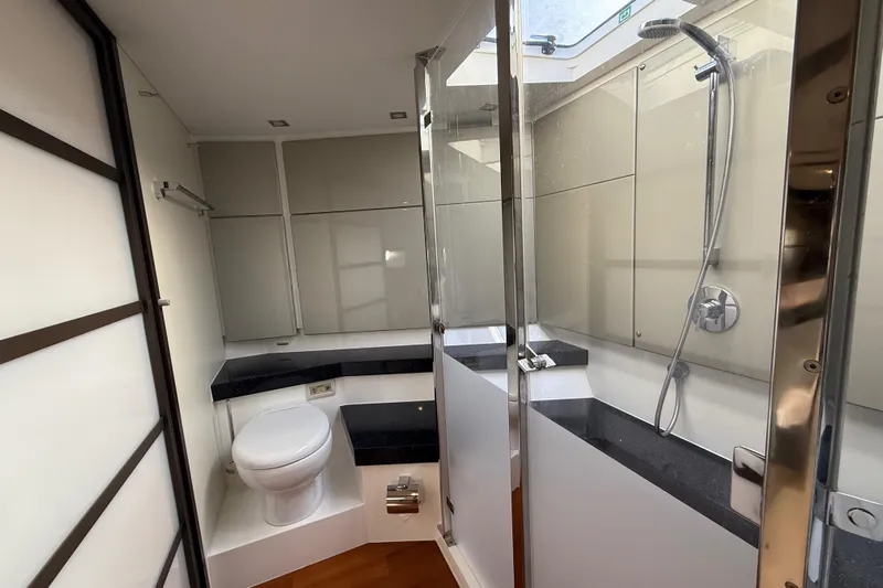  Yacht Photos Pics Luxurious bathroom in 2013 Fairline Targa 62 GT yacht with modern fixtures and shower.