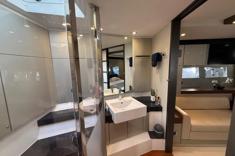  Yacht Photos Pics Luxurious interior of 2013 Fairline Targa 62 GT yacht with modern bathroom and seating area.