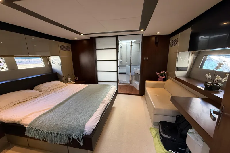  Yacht Photos Pics Luxurious bedroom interior of 2013 Fairline Targa 62 GT yacht with modern amenities.