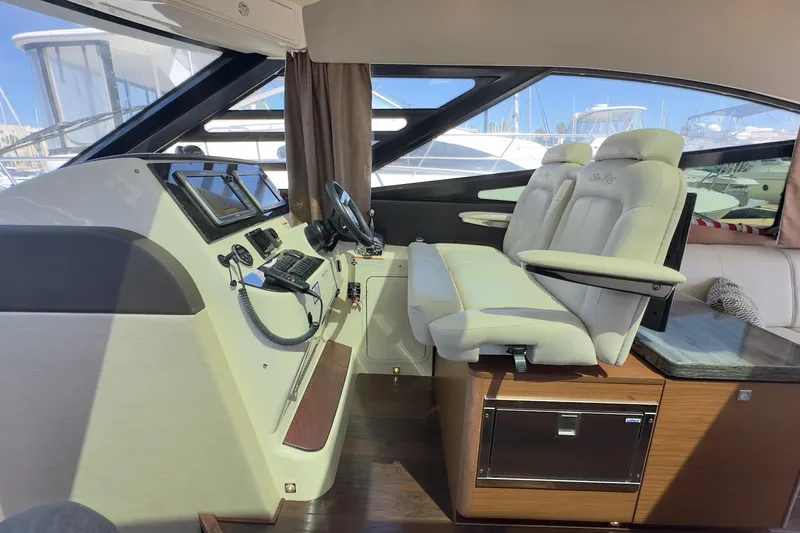 Baby Pie Yacht Photos Pics Luxurious 2016 Sea Ray 470 Sundancer helm with plush seating and modern controls.