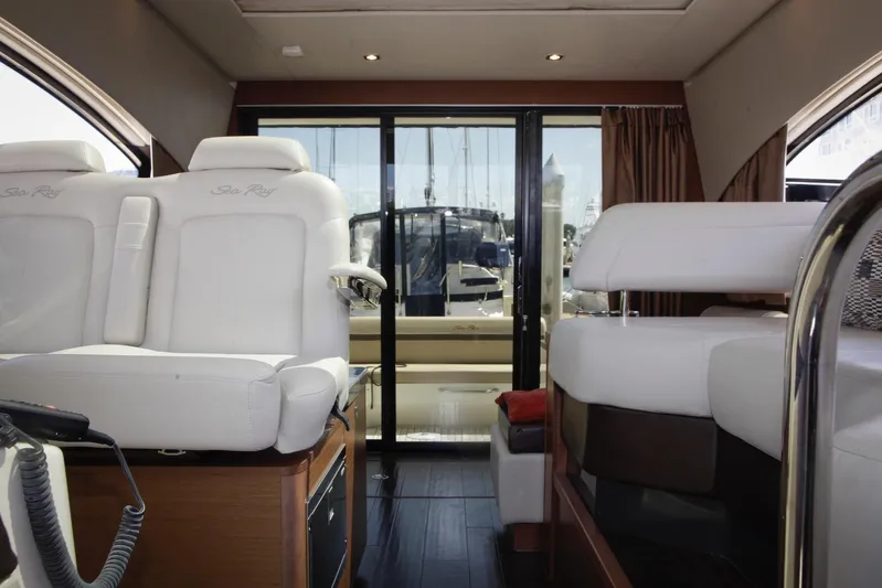 Baby Pie Yacht Photos Pics Interior of 2016 Sea Ray 470 Sundancer yacht with luxurious white seating.