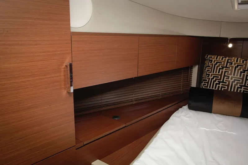 Baby Pie Yacht Photos Pics Luxurious interior of 2016 Sea Ray 470 Sundancer yacht with wooden cabinetry and stylish bedding.