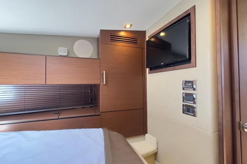 Baby Pie Yacht Photos Pics Interior cabin of 2016 Sea Ray 470 Sundancer with TV and modern wood finishes.