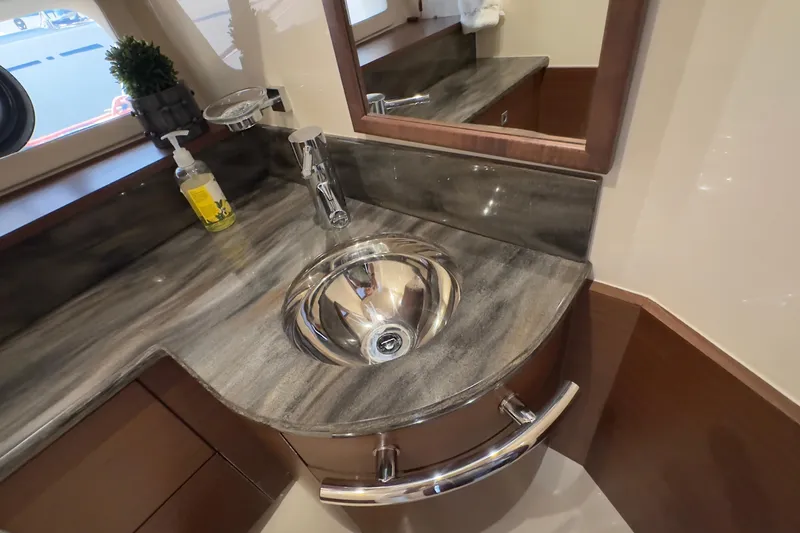 Baby Pie Yacht Photos Pics Luxurious bathroom sink area in 2016 Sea Ray 470 Sundancer yacht.