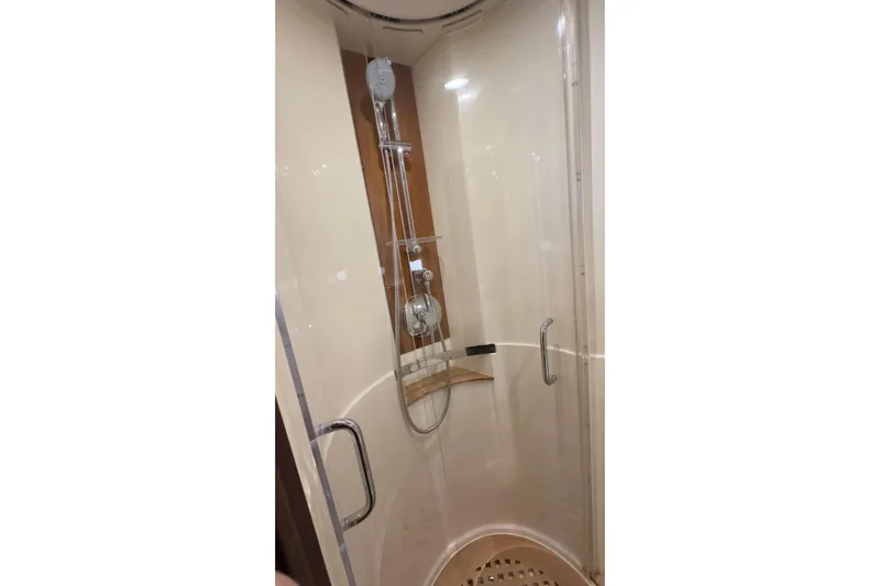 Baby Pie Yacht Photos Pics Shower area in 2016 Sea Ray 470 Sundancer yacht, featuring modern fixtures and glass door.