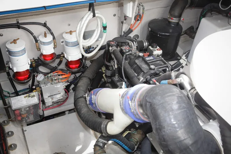 Baby Pie Yacht Photos Pics Engine room of 2016 Sea Ray 470 Sundancer with visible components and hoses.