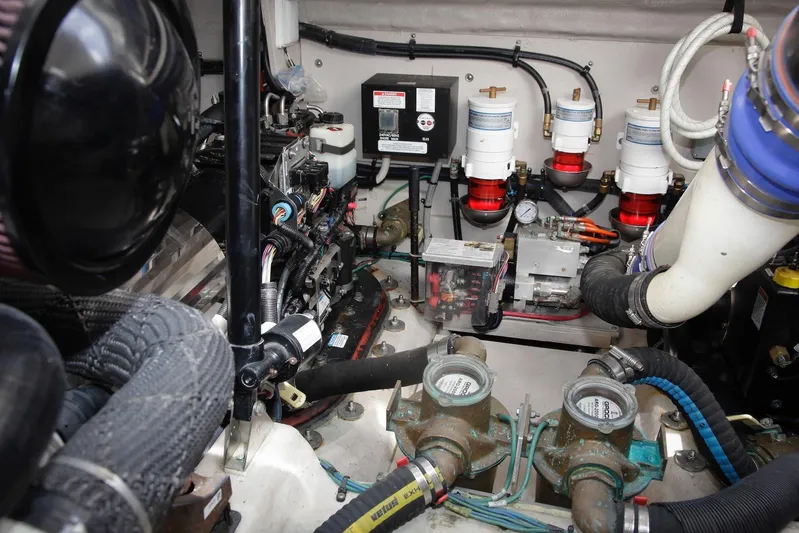 Baby Pie Yacht Photos Pics Engine room of 2016 Sea Ray 470 Sundancer, showcasing mechanical components and systems.
