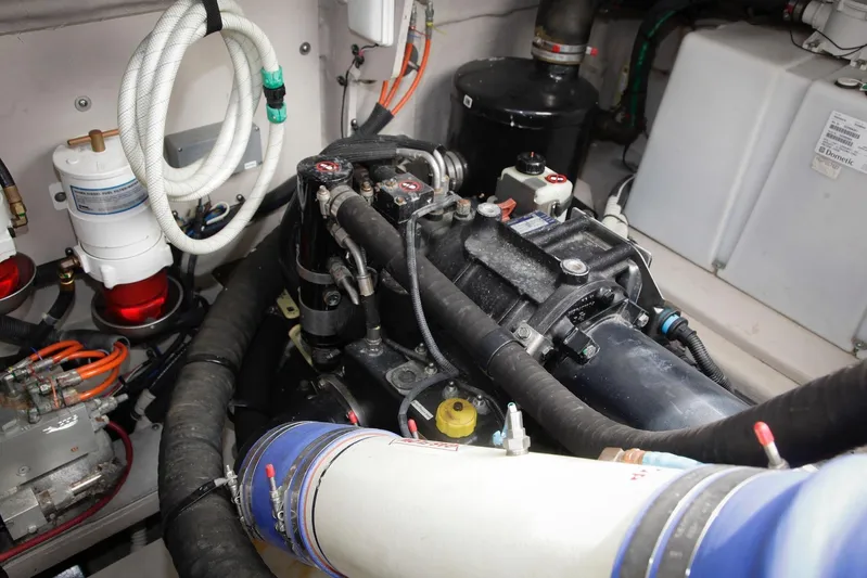 Baby Pie Yacht Photos Pics Engine room of 2016 Sea Ray 470 Sundancer with visible components and hoses.