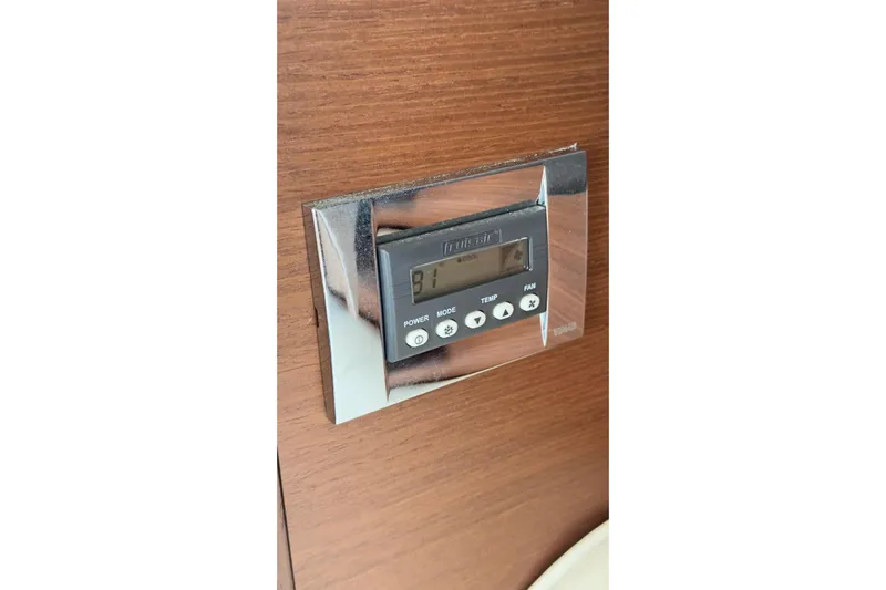 Baby Pie Yacht Photos Pics Digital control panel on 2016 Sea Ray 470 Sundancer yacht, mounted on wooden surface.