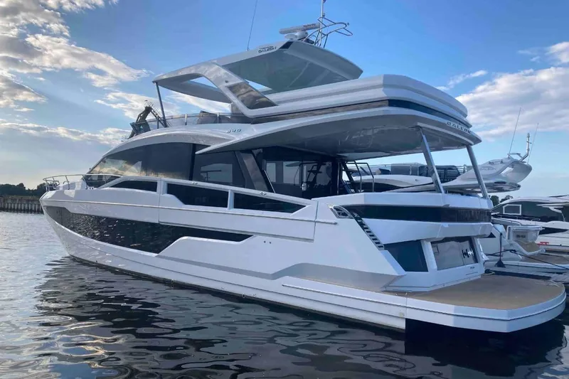  Yacht Photos Pics 2023 Galeon 640 Fly yacht on water, showcasing sleek design and modern features.